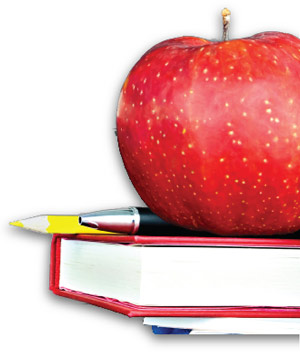 Image of an apple sitting on a school book