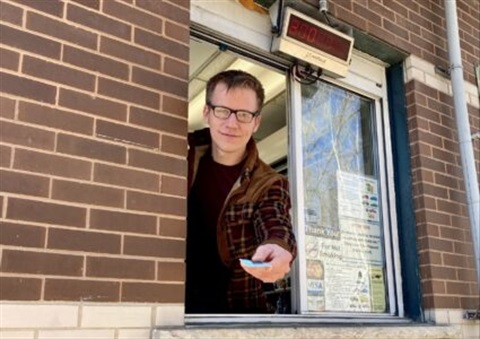 attendant peering out of the Scale House window handing out a purchased punch card