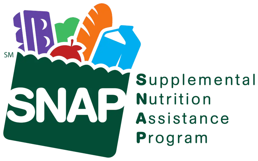 SNAP Benefits Logo.  Green bag with SNAP in white lettering, sticking out of the bag is a purple egg carton, a red apple, an orange loaf of bakery bread, a blue carton of mile and a green vegetable.  The acronym for SNAP is beside the bag.