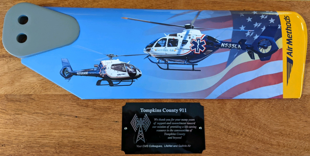 Photo of plaque from Air Methods to Tompkins County 911