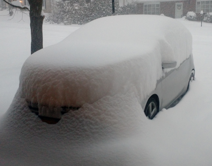 Image of snow-covered vehicle.